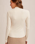 The Kory Ivory Lettuce Edge Turtleneck Top