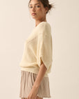 The Remy Cream Pointelle Ribbed Knit Sweater
