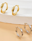 The Twist Gold Huggie Earrings
