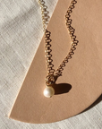 The Tiny Pearl Drop Necklace by Cire' Alexandria