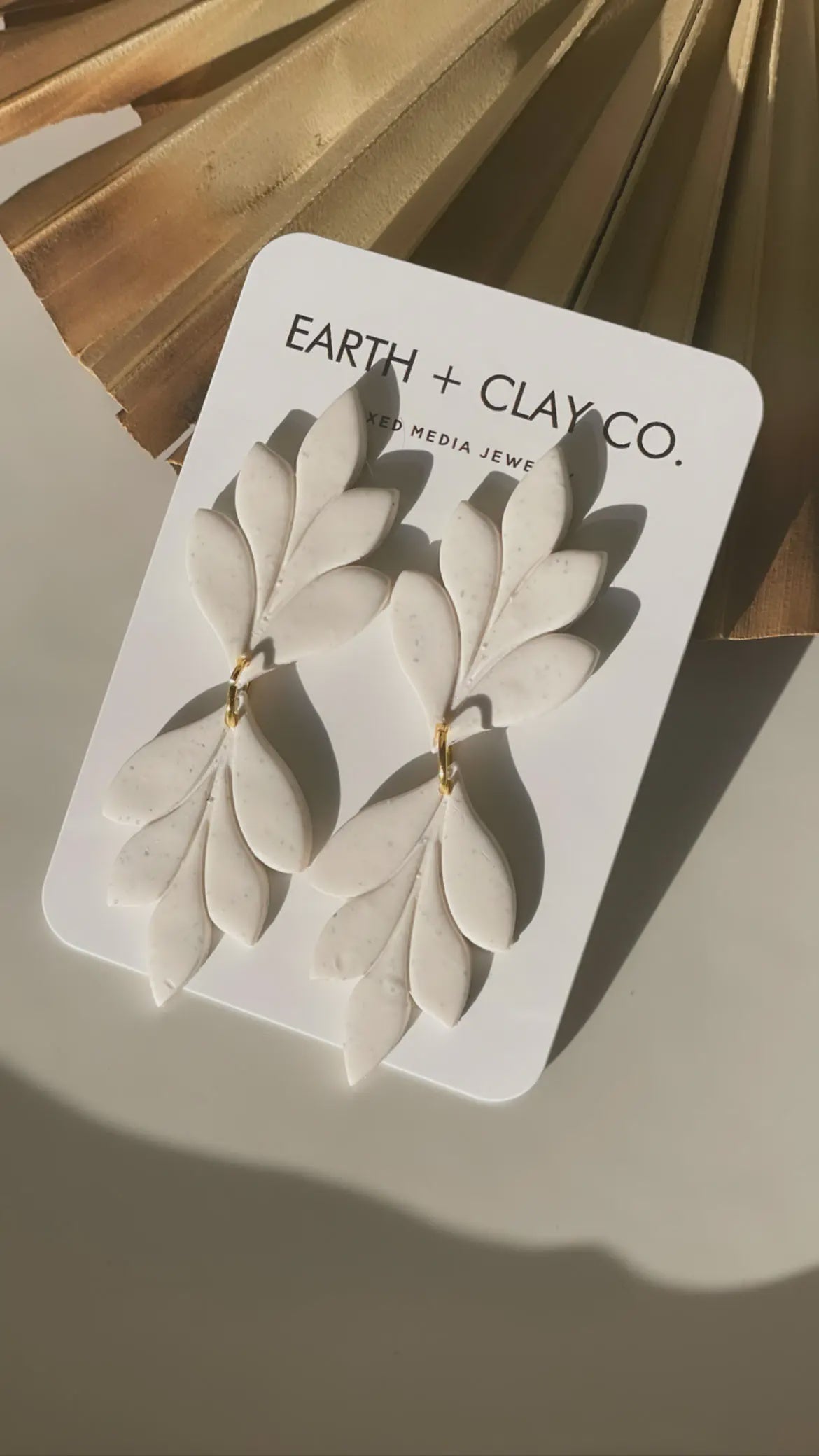 The Peppered White Double Leaf Earrings by Earth + Clay Collective