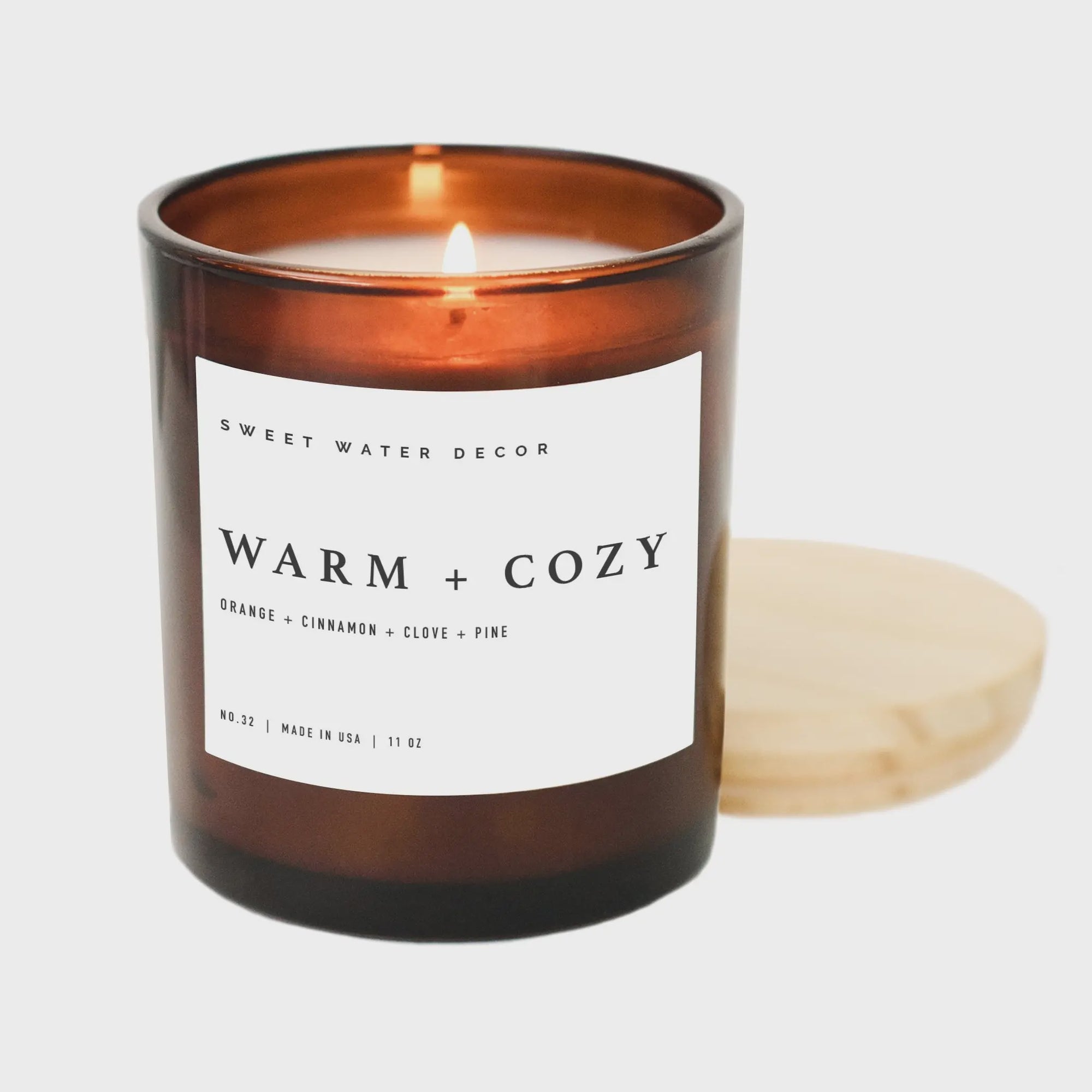 The Warm + Cozy Soy Candle in Amber Jar by Sweet Water Decor