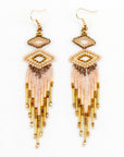 Beaded earrings with a small beaded wide diamond shape at top, a medium diamond shape below and danging beaded fringe below that. Colors: gold, bronze and cream. Earrings have hooks.