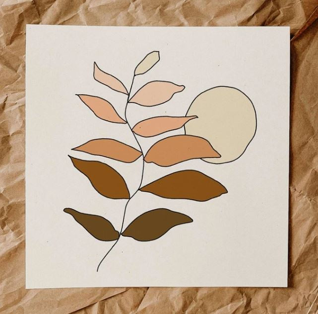 A dainty line drawing of a branch, placed vertically on the print, dark brown leaves at the bottom fade into peach tones at the top. An assymetrical, pale yellow sun is behind it. White background.