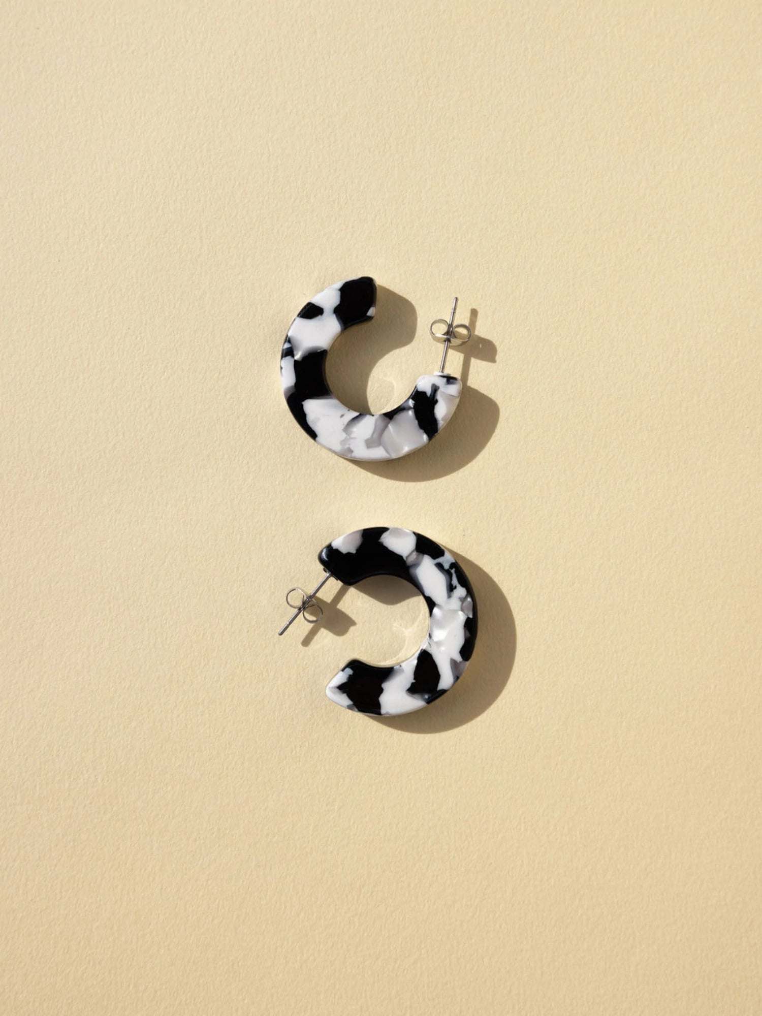 The Ray Marbled Acetate Hoops by Nat + Noor