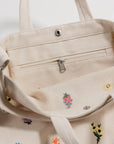 The Embroidered Ditsy Floral Horizontal Duck Bag by Baggu
