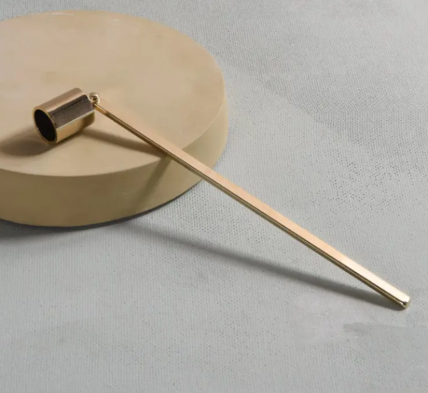 The Gold Tone Candle Snuffer