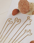 The Squigg Bun Pin by Rebekah J. Designs